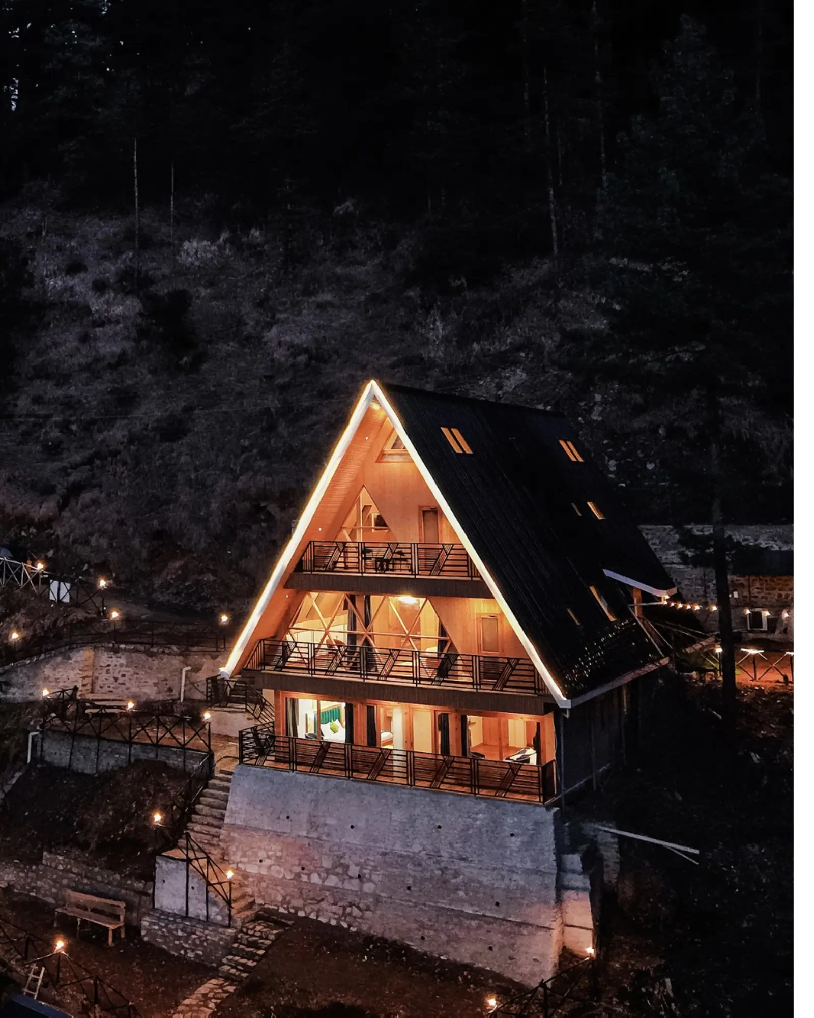 The Bagh's illuminated A-frame building at night
